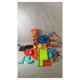 Collection of childrenï¿½s playset pieces and toy