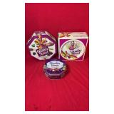 Three empty Quality Street collectible candy tins