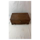 Wooden jewelry box featuring a blue felt-lined