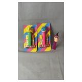 Three PEZ candy dispensers, including two sealed