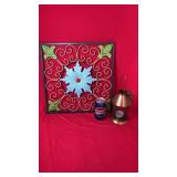 Decorative metal wall art featuring colorful
