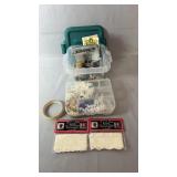 Crafting supplies including assorted buttons,