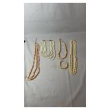 Collection of faux pearl jewelry including four
