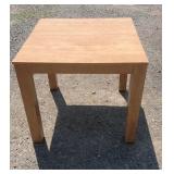 Solid wood table with a natural finish and sturdy