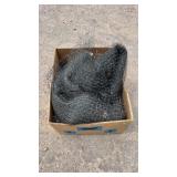 Roll of black deer netting, neatly bundled in a