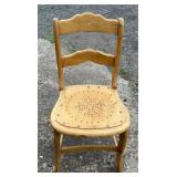 Wood chair with shaped ladder-style back and