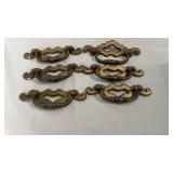 Set of six decorative brass-tone drawer pulls