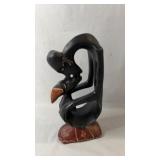 Decorative carved wooden sculpture featuring an