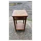 Wood side table featuring a rectangular top with