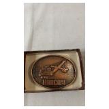 Harnan belt buckle featuring a raised P&H tracked