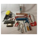 Selection of hand tools and workshop supplies