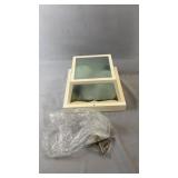 Frosted glass wall sconce with a white metal