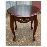 Wood accent side table with shaped top, curved