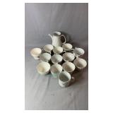 Collection of 13 mixed teacups and a matching
