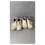 Two pairs of white lace-up children's leather