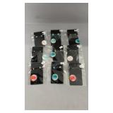 Nine pairs of pierced earrings in a variety of