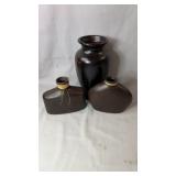 Collection of three decorative vases, one black