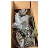 Box containing galvanized brackets, steel cable,