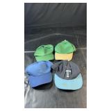 Four baseball-style caps with blue, green and