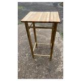 Tall bar-height table featuring a rectangular