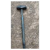 Large heavy-duty sledge hammer with a long metal