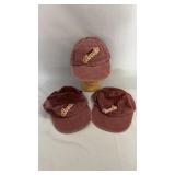 Three burgundy Labatt's Copper baseball-style