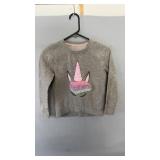 Soft gray sweatshirt featuring a colorful unicorn