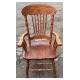 Wood armchair featuring an elaborately carved