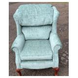 Comfortable upholstered armchair in a soft