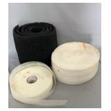 Collection of rolled filter media and material in