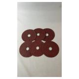Six brown abrasive grinding discs with centre