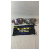 Two pairs of Cooloo ski goggles, one with a