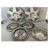 Collection of four vintage hubcaps and two wheel