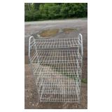 Freestanding white metal wire storage rack with