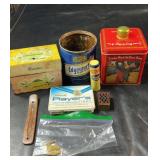Collection of older tins and containers featuring