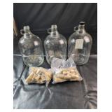 Glass Jugs & Wine CorksThree glass jugs with