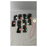 Collection of 10 pairs of pierced earrings in a