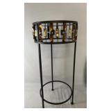 Round glass-top accent table with black metal