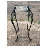 Tall decorative metal plant stand with curved