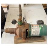 Myers electric water pump mounted on a wooden