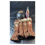 Four brown knit golf club head cozies with