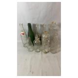 Vintage glass bottle collection including RC