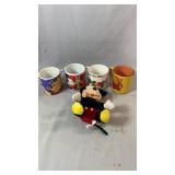 Four Disney character mugs featuring Winnie the