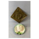 Small brass wall hanging with an embossed figural