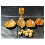 Collection of wooden pieces featuring four fruit-
