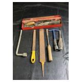 Collection of hand tools featuring several metal