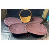 Four round braided chair cushions in coordinating