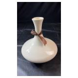 Cream-coloured ceramic vase with a wide rounded