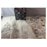 Three white branch-pattern curtain panels,