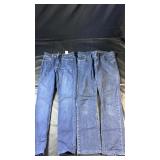 Two pairs of blue denim jeans, including